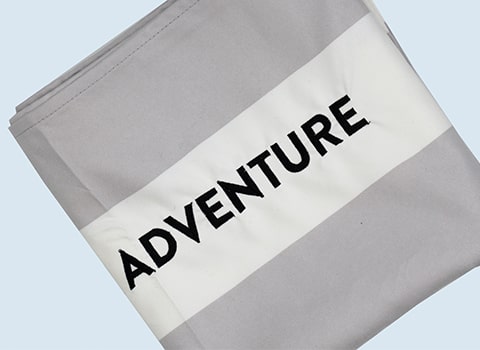 Cobra RIBs Merchandise Grey Towel with the word Adventure